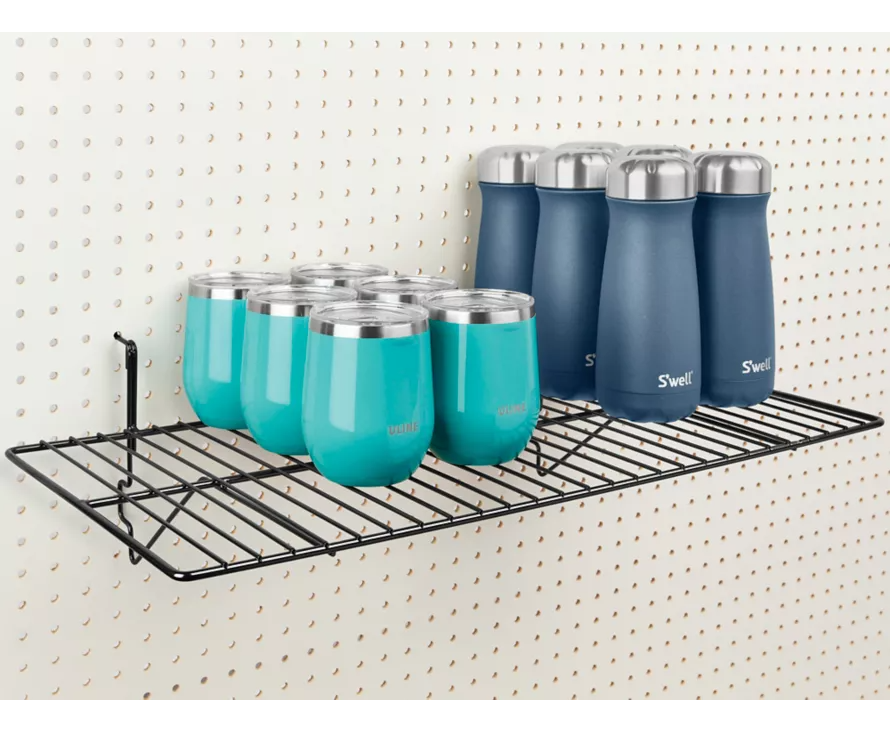 Heavy-duty black wire shelf mounted on a white pegboard, ideal for organizing large tools or hardware store merchandise.