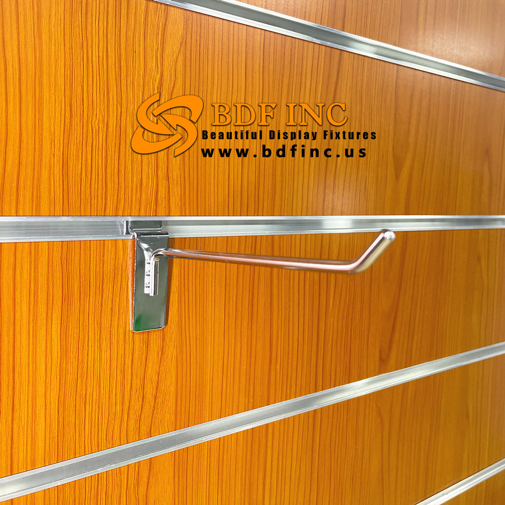 8 inch chrome slatwall hook displaying premium retail products in boutique setting