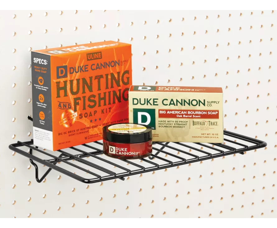 The BDF universal shelf in use on a white wire gridwall, perfectly displaying a variety of retail products.