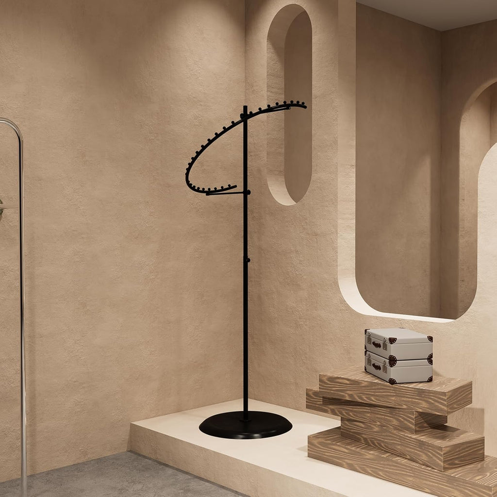 Detail of heavy weighted base on black spiral clothing rack, demonstrating stability features