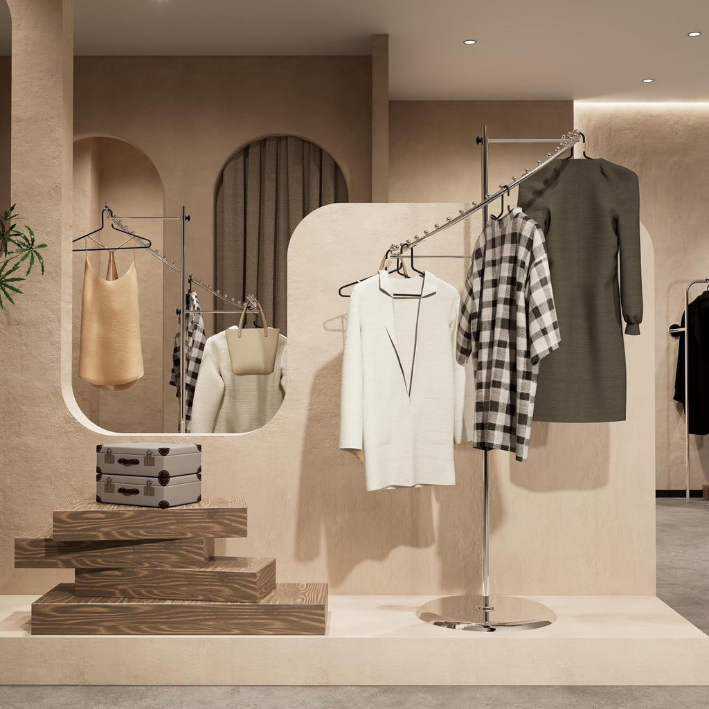 Chrome spiral clothing rack in retail store setting, displaying multiple garments with professional presentatio