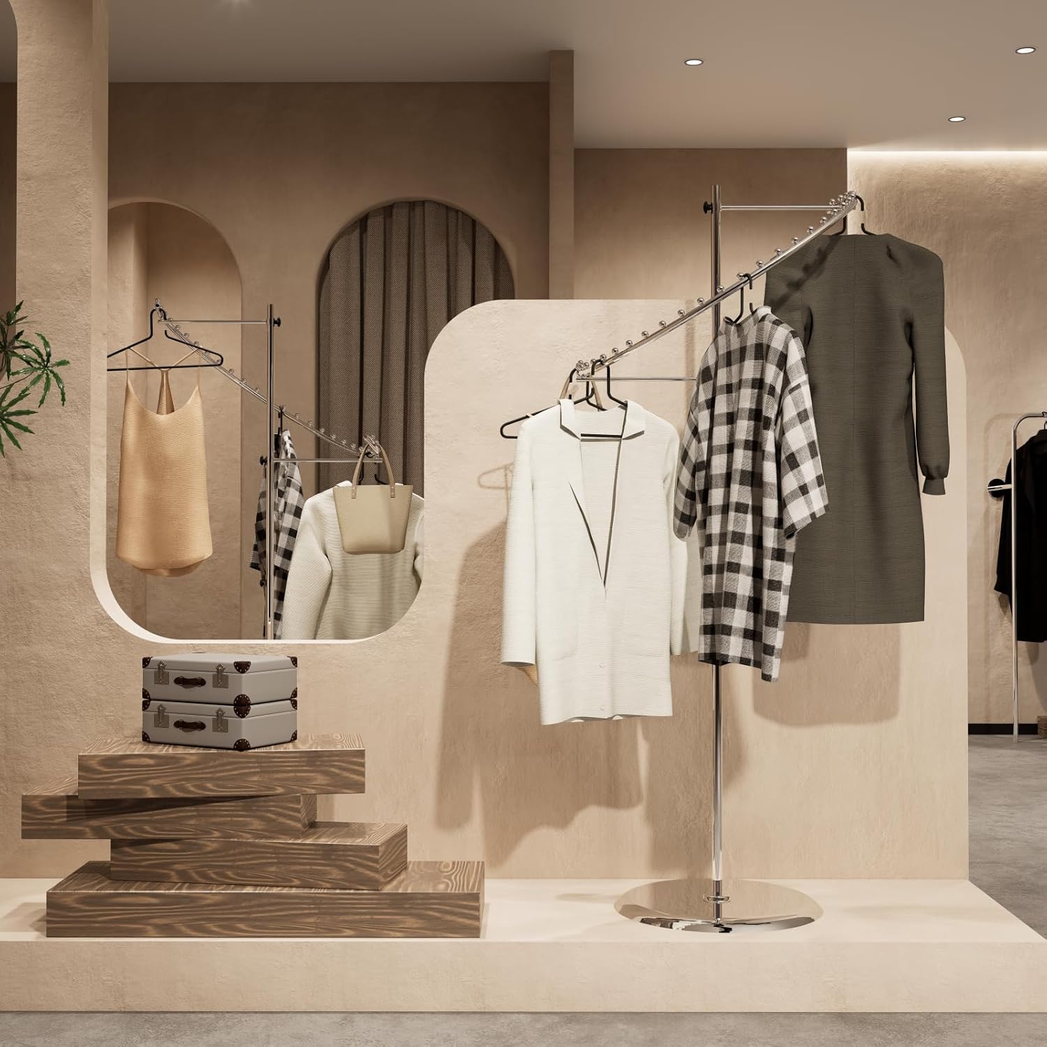 Chrome spiral clothing rack in retail store setting, displaying multiple garments with professional presentatio