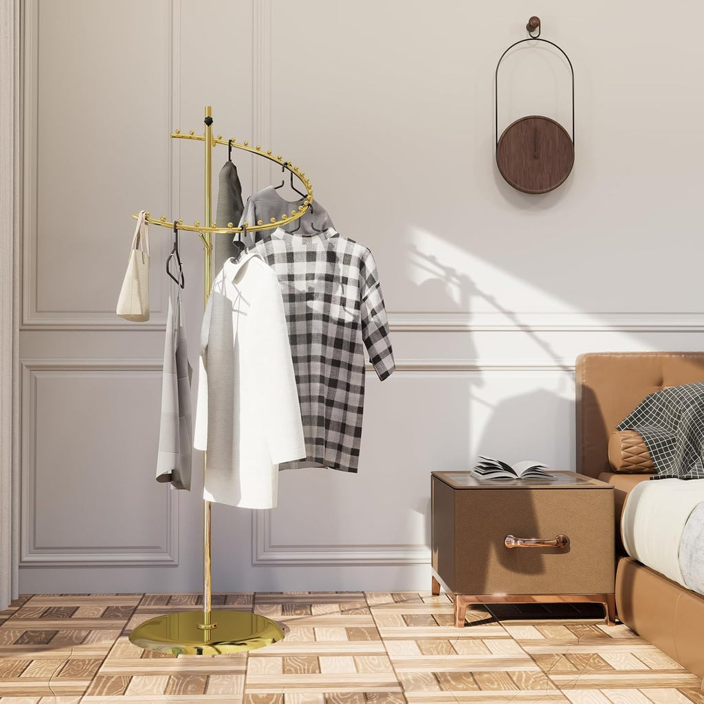 Detail of heavy weighted base on gold spiral clothing rack, demonstrating luxury stability features