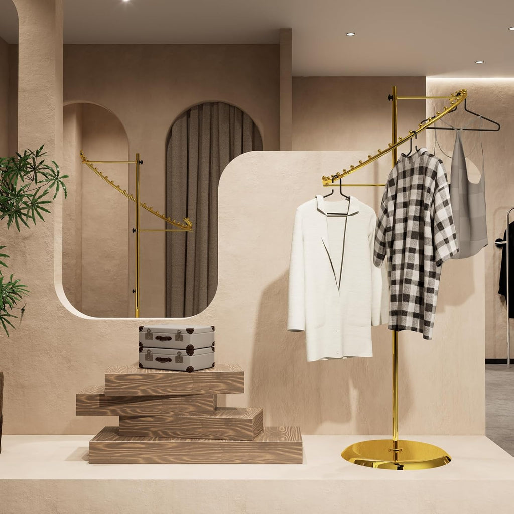 Gold spiral clothing rack in luxury retail setting, displaying premium garments with elegant presentation