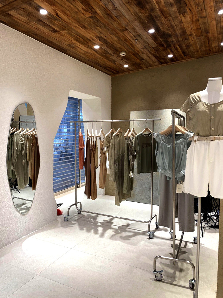 BDF heavy duty single bar rack in retail store setting, commercial clothing display for wholesale purchase