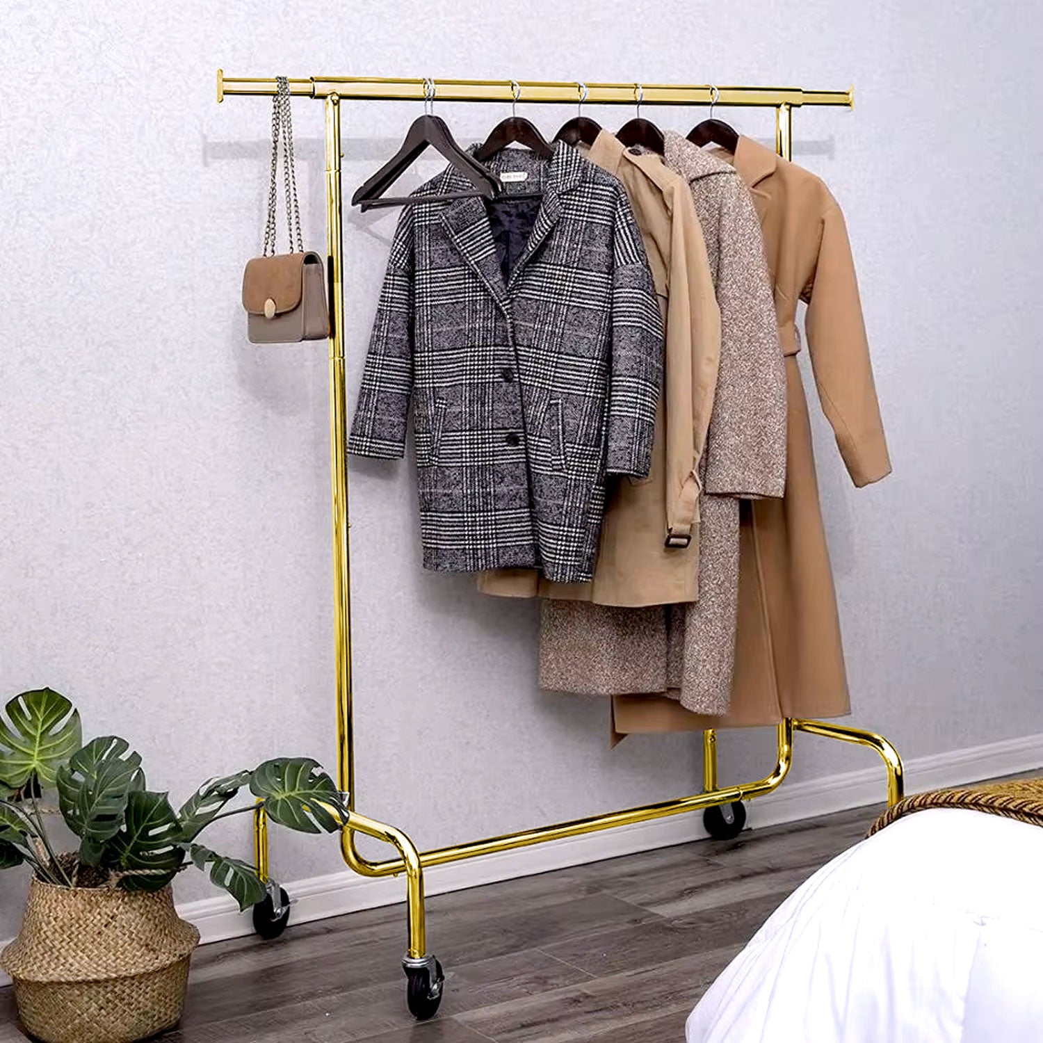 Heavy duty single bar gold clothing rack in the home