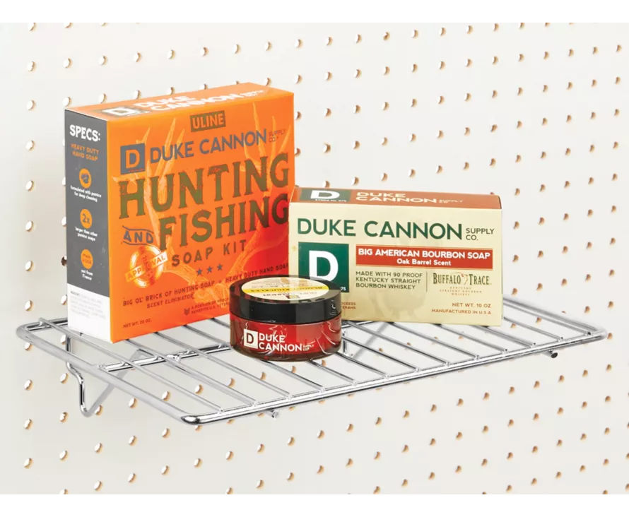 The versatile chrome wire shelf mounted on a white pegboard, ideal for hardware or salon supply displays.