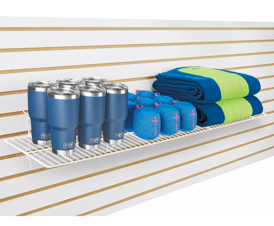 Extra-wide 12x48 inch slatwall wire shelf installed on white slatwall, creating massive display space for retail merchandise.