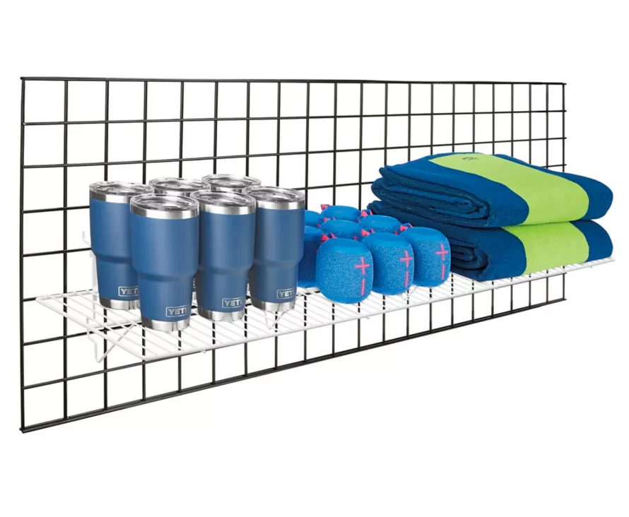 Massive 12x48 inch white wire shelf installed on wire gridwall, offering a bright, organized display solution for fashion retailers and boutiques.