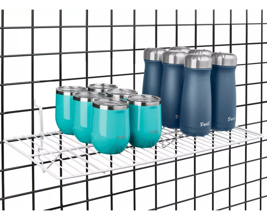 12x24 inch white wire shelf installed on gridwall, providing a clean, modern display for handbags and accessories.